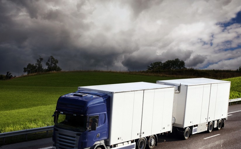 bigstockphoto_Truck_Driving_On_Country-Road_2943700